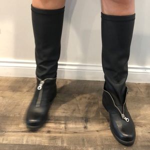 Leather boots with unique design.
